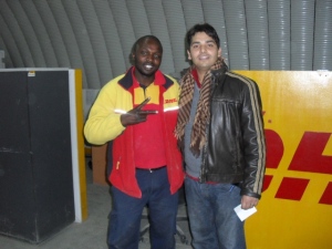 Sameer and DHL ground crew member reflect the cooperative spirit manifest throughout this relief mission.        Image: DHL-OAIX